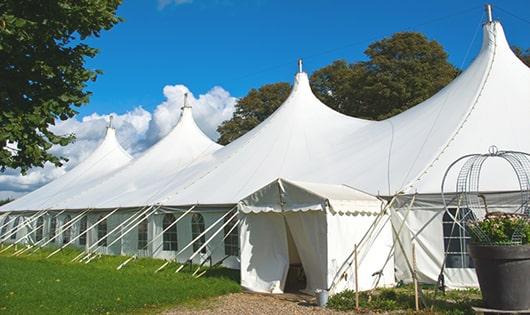 a line of sleek and modern portable toilets ready for use at an upscale corporate event in South Hadley, MA